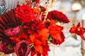 Red gold golden color decor, floral arrangement. Festive bouquet, table decoration. Traditional Chinese New Year party Royalty Free Stock Photo