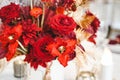 Red gold golden color decor, floral arrangement. Festive bouquet, table decoration. Traditional Chinese New Year party Royalty Free Stock Photo