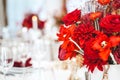 Red gold golden color decor, floral arrangement. Festive bouquet, table decoration. Traditional Chinese New Year party Royalty Free Stock Photo