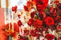 Red gold golden color decor, floral arrangement. Festive bouquet, table decoration. Traditional Chinese New Year party Royalty Free Stock Photo