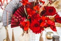 Red gold golden color decor, floral arrangement. Festive bouquet, table decoration. Traditional Chinese New Year party Royalty Free Stock Photo