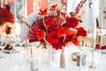 Red gold golden color decor, floral arrangement. Festive bouquet, table decoration. Traditional Chinese New Year party Royalty Free Stock Photo