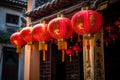 Red and gold lantern strung up outside the entrance of an temple. Capture the vibrant colors and symbols of luck and fortune that