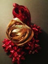 Red and gold. Shiny holiday ribbon for wrapping gifts for Christmas and Valentine`s Day.