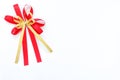 Red and gold satin bow ribbon on white background Royalty Free Stock Photo