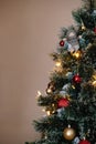 Red and golden balls on a Christmas tree with lights and bokeh Royalty Free Stock Photo