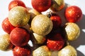 Red and golden Christmas balls decoration top view.