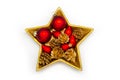 Red and golden christmas decoration in a golden star-shaped bowl on a white  background Royalty Free Stock Photo