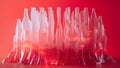 A red gradient background with translucent white lines, creating an abstract sculpture of multiple bottles in the foreground Royalty Free Stock Photo