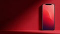 Red gradient wallpaper on modern smartphone screen against red wall display technology Royalty Free Stock Photo