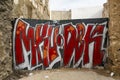 Red graffiti on a aluminum gate Royalty Free Stock Photo