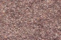 Red granite crumb, background, texture, red burgundy stone granules Royalty Free Stock Photo