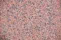 Red granite texture with feldspar, quartz, and mica