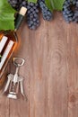 Red grape, wine bottle and corkscrew Royalty Free Stock Photo