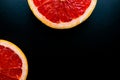 red grapefruit on black background Royalty Free Stock Photo