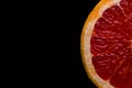 red grapefruit on black background Royalty Free Stock Photo