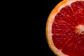 red grapefruit on black background Royalty Free Stock Photo