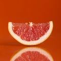 Red grapefruit slice Royalty Free Stock Photo