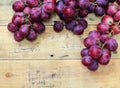 Red grapes on old wood table