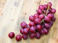 Red grapes on old wood table