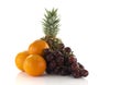 Red grapes oranges and pineapple Royalty Free Stock Photo