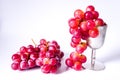 Red grapes and a silver cup