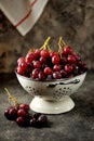 Red grapes in a white colander on a gray background. Royalty Free Stock Photo