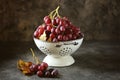 Red grapes in a white colander on a gray background. Royalty Free Stock Photo