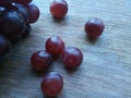 Red Grapes on wood