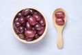 Red grapes in wooden bowl and spoon