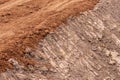 Red gravel soil on the dirt road Royalty Free Stock Photo