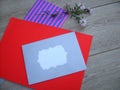 Red and gray envelope and flower