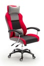 A red and gray office chair with a black back and a white pillow Royalty Free Stock Photo