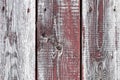 Red-gray wooden background. vertical boards. old paint peels off. old boards. Red gray wood texture of a worn painted board. Red Royalty Free Stock Photo