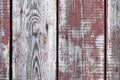 Red-gray wooden background. vertical boards. old paint peels off. old boards. Red gray wood texture of a worn painted board. Red Royalty Free Stock Photo