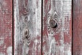 Red-gray wooden background. vertical boards. old paint peels off. old boards. Red gray wood texture of a worn painted board. Red Royalty Free Stock Photo