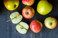 Red and green apples on a dark wood background - overhead view Royalty Free Stock Photo