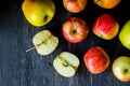 Red and green apples on a dark wood background - overhead view Royalty Free Stock Photo