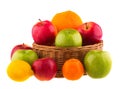 Red and green apples, oranges and lemons in a wooden basket Royalty Free Stock Photo