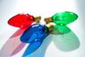 Red Green and Blue Christmas Lightbulbs on White Background Royalty Free Stock Photo