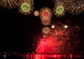 Red, green, blue, neon, pink, white and golden sparks of fireworks and salutes exploding in the sky Royalty Free Stock Photo