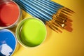 Primary colors in acrylic paint in metal tins still life art supply  and brushes Royalty Free Stock Photo