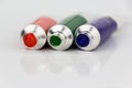 Red, green, blue paint tubes on white background Royalty Free Stock Photo