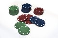 Red, green and blue poker chips in piles on white background Royalty Free Stock Photo