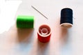 Red, green and blue spools of thread for sewing. Royalty Free Stock Photo