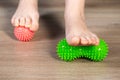 Red and green body foot massager. Medical home physiotherapy. Copy space for text Royalty Free Stock Photo