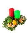 Red and green candles, mandarin and lime. Christmas composition