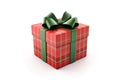 Red with green checkered Christmas gift box decorated a green bow, close up, isolated on white. Royalty Free Stock Photo