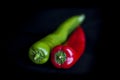 Red and green chilli on a black background Royalty Free Stock Photo
