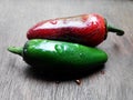 red and green chillis on woodtable